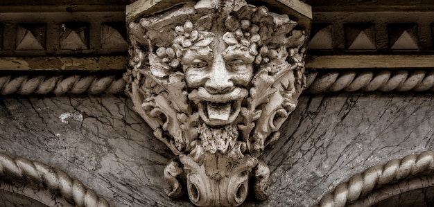 Italy, turin. this city is famous to be a corner of two global magical triangles. this is a protective mask of stone on the top of a luxury palace entrance, dated around 1800