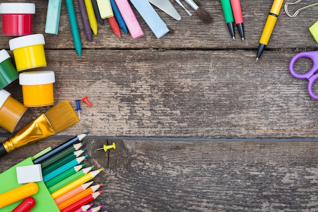 Items for children's creativity on a wooden background