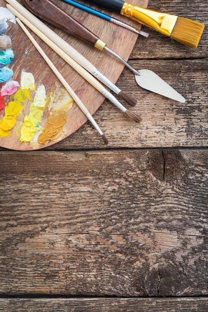 Items for children's creativity on a wooden background