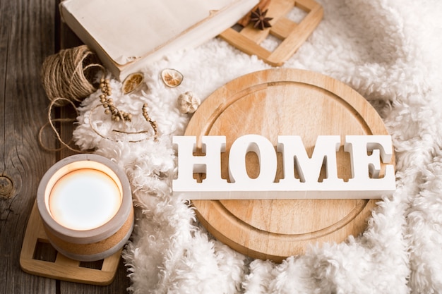 Items of cozy home decor with wooden letters