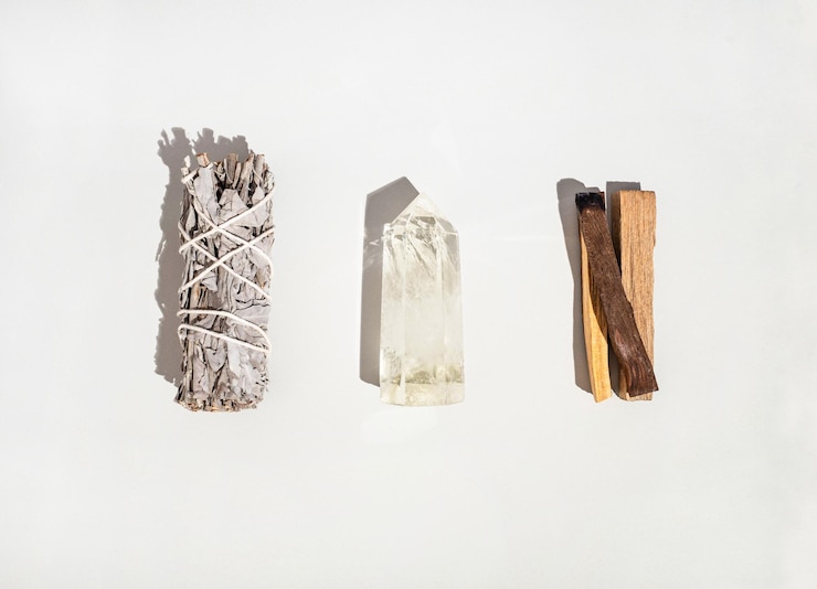 Photo items for spiritual cleansing - sage bundle palo santo incense sticks and quartz crystal