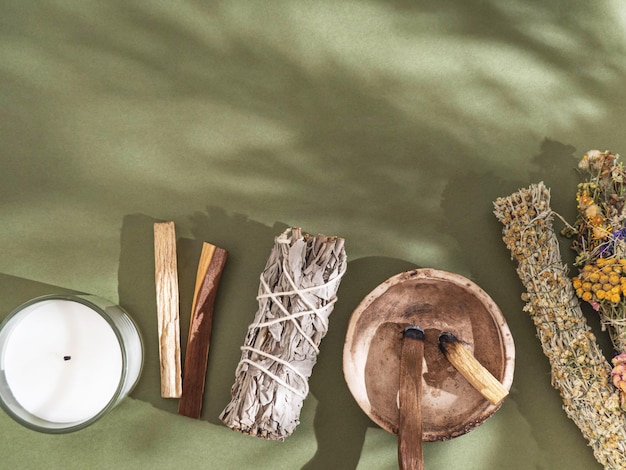 Items spiritual cleansing - sage and various herbs bundles palo santo incense sticks and candle