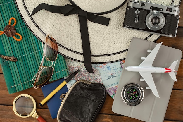 items used in travel on the background of maps