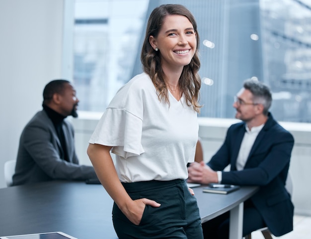 Its always been my truest ambition to succeed big Portrait of a confident young businesswoman standing in an office with her colleagues in the background