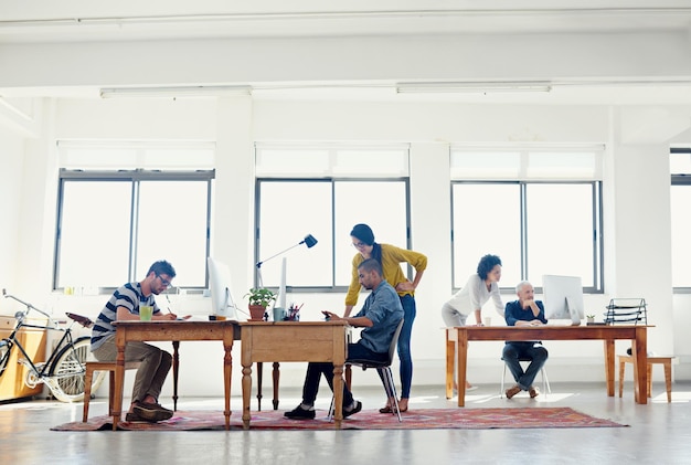 Its a creative environment shot of a group of creative professionals working in an office