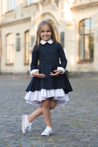 Its easy to be nice if you feel comfortable Small kid wear uniform outdoors Back to school style Fashion schoolwear Formal education September 1 Knowledge day Elegance never goes out of style