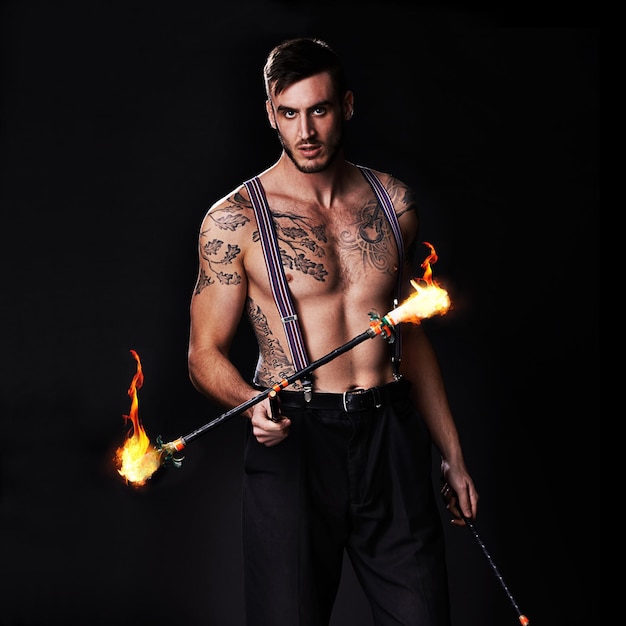 Its getting hot in here Shot of a performer holding a flaming stick