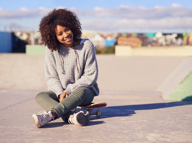 Its a great day to skate Shot of a young woman in a skate park