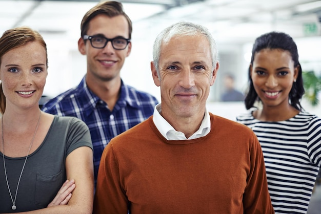 Photo ive got my team to back me up shot of a diverse group of business professionals