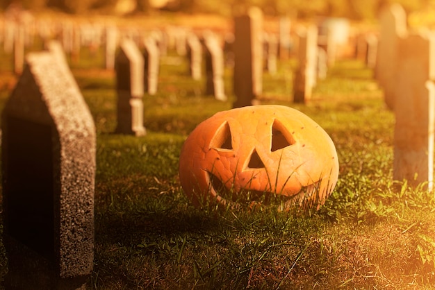 Jack-o-Lantern on a graveyard with the dramatic scene background