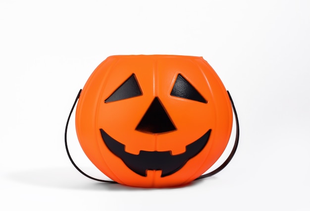 jack o lantern orange basket or bucket for sweets isolated