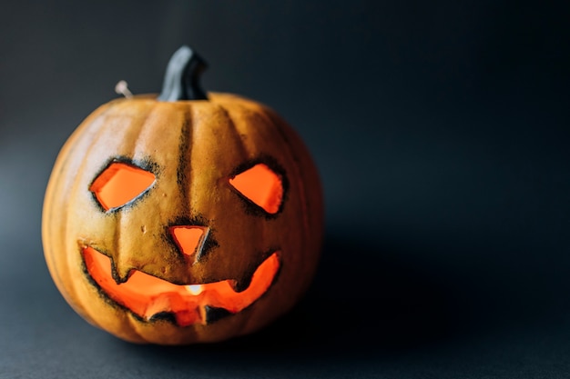 Jack-o-lantern pumpkin. Halloween background with copy space