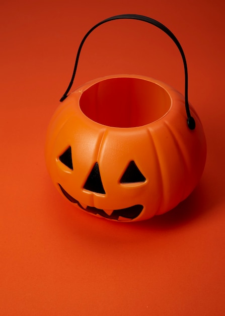 Jack o lantern pumpkin on an orange background