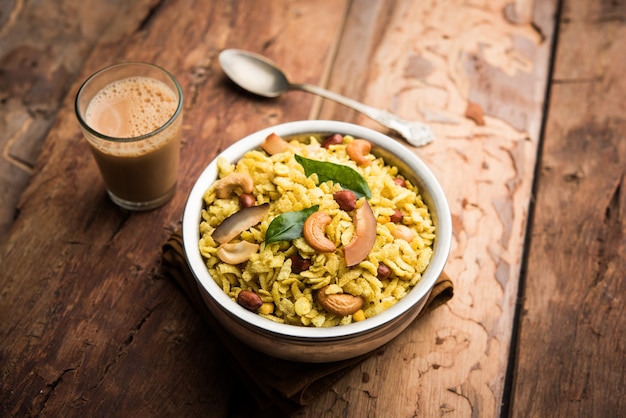 Jada Poha Namkeen Chivda or Thick Pohe Chiwda is a jar snack with a mix of sweet, salty and nuts flavours, served with tea. selective focus