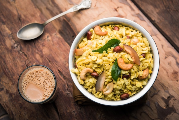 Jada Poha Namkeen Chivda or Thick Pohe Chiwda is a jar snack with a mix of sweet, salty and nuts flavours, served with tea. selective focus