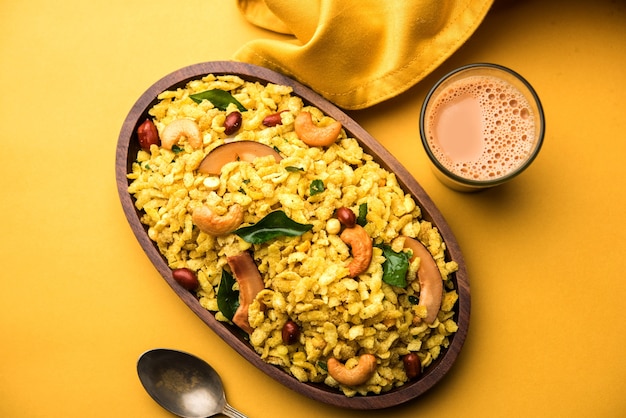 Jada Poha Namkeen Chivda or Thick Pohe Chiwda is a jar snack with a mix of sweet, salty and nuts flavours, served with tea. selective focus