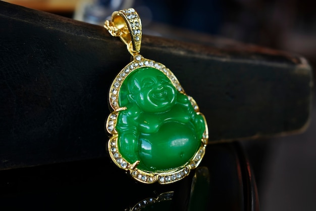 Photo jade is a gold pendant necklace