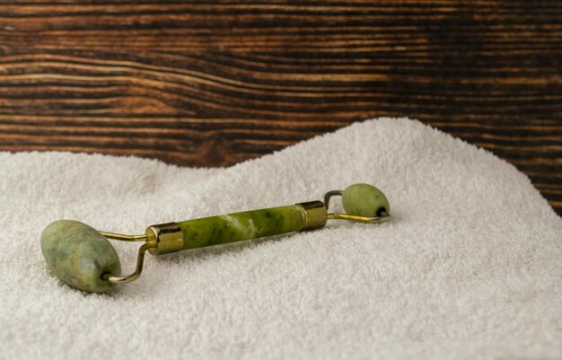 Jade roller on a white towel