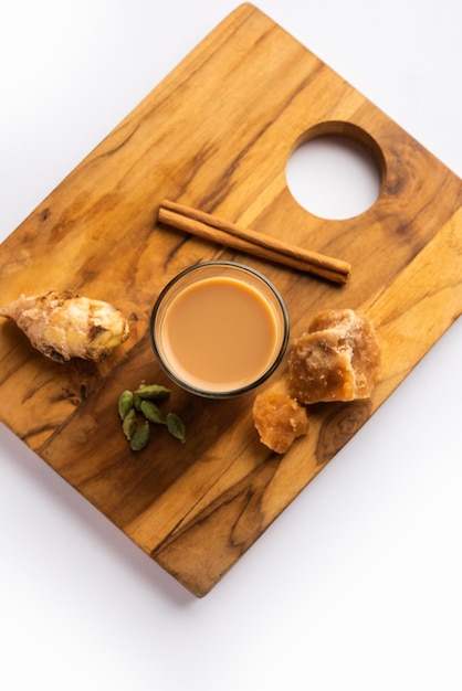 Jaggery tea or Gur ki chai with ingredients like gud ginger or adrak green cardamom and cinnamon