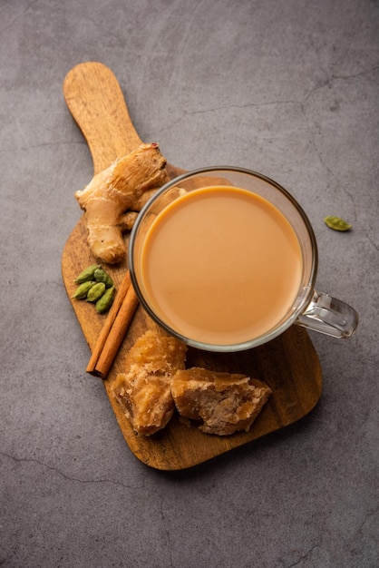 Jaggery tea or Gur ki chai with ingredients like gud ginger or adrak green cardamom and cinnamon