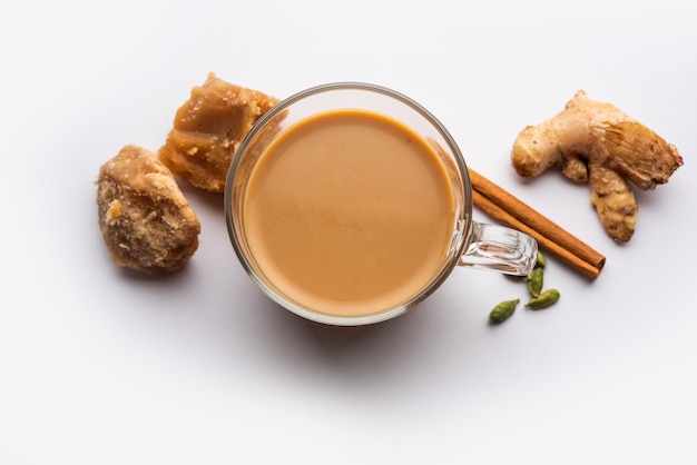 Jaggery tea or Gur ki chai with ingredients like gud ginger or adrak green cardamom and cinnamon