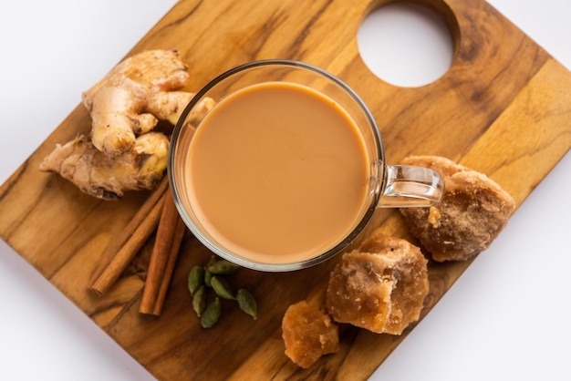 Jaggery tea or Gur ki chai with ingredients like gud ginger or adrak green cardamom and cinnamon