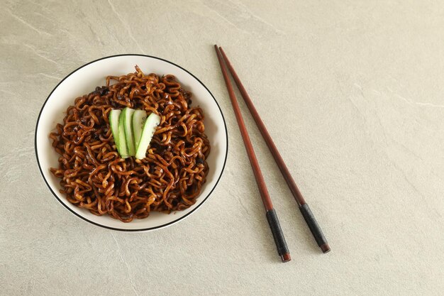 Jajangmyeon or JJajangmyeon is Korean Noodle with Black Sauce and cucumber.