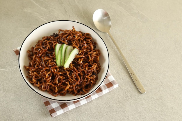 Jajangmyeon or JJajangmyeon is Korean Noodle with Black Sauce and cucumber.