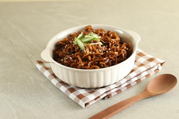 Jajangmyeon or JJajangmyeon is Korean Noodle with Black Sauce and cucumber.