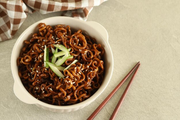 Jajangmyeon or JJajangmyeon is Korean Noodle with Black Sauce and cucumber.