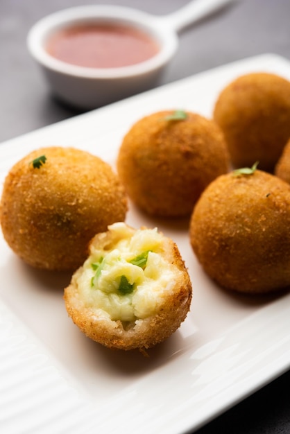 Jalapeno cheese balls or poppers served with tomato ketchup