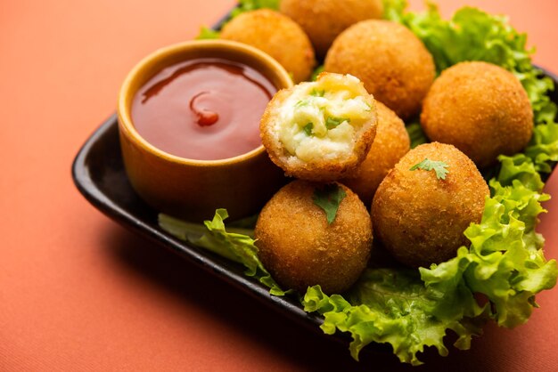 Jalapeno cheese balls or poppers served with tomato ketchup