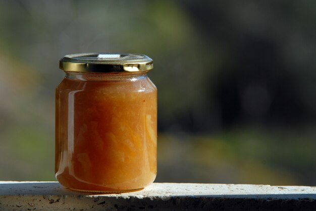 Jam jar in the garden outdoors