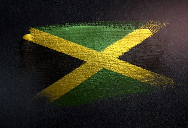 Jamaica Flag Made of Metallic Brush Paint on Grunge Dark Wall