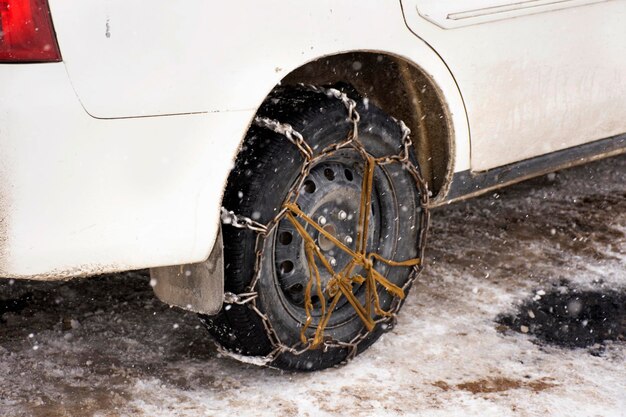 JAMMU KASHMIR INDIA MARCH 22 Indian people use chains tied at tire wheels car for protect slip on driving while drive on snow covered road Leh Ladakh on March 22 2019 in Jammu and Kashmir India