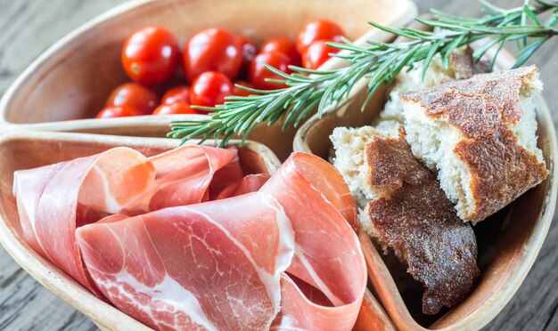 Jamon with bread and cherry tomatoes