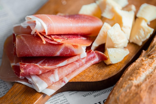 Jamon with bruschetta and parmesan.Delicious appetizer for wine.Italian appetizer. Jamon and salami