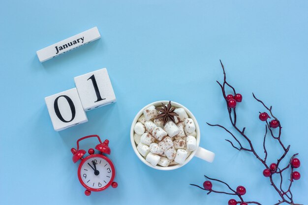 January 1st Cup of cocoa with marshmallows and alarm clock
