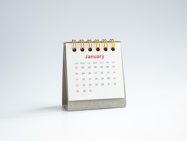 A january 2023 calendar desk for the organizer to plan and
reminder isolated on white background minimal style white small
table calendar with the page of the first month happy new year
2023