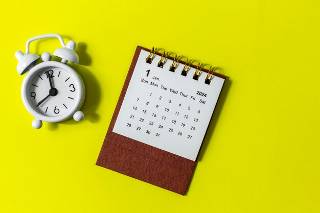 January 2024 Desk calendar for 2024 on a yellow background with copy space