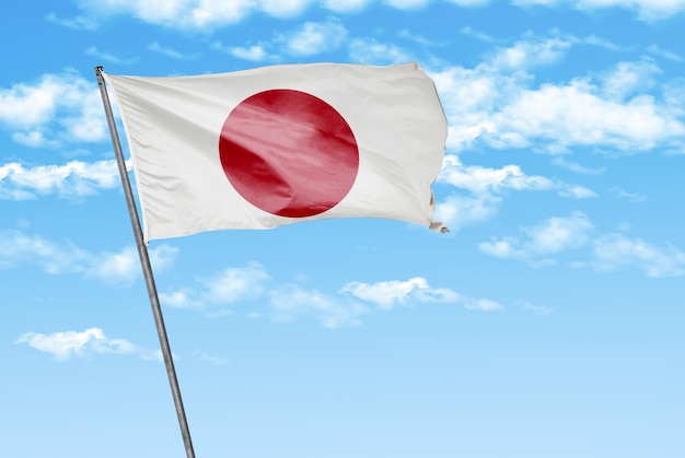 雲の背景画像と空色に日本 3 D 手を振る旗