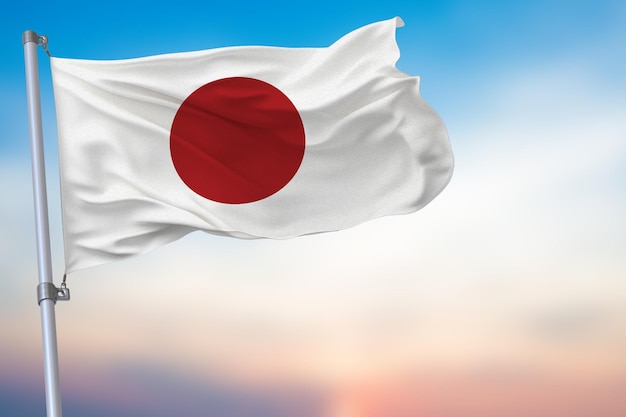 Photo japan waving flag on blue sky with national symbol official emblem