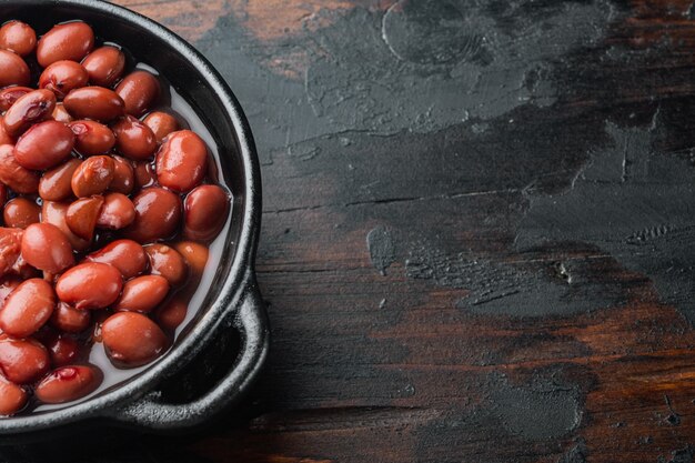 Japanese canned food ingredient, sweet red beans, on old dark  wooden table table 