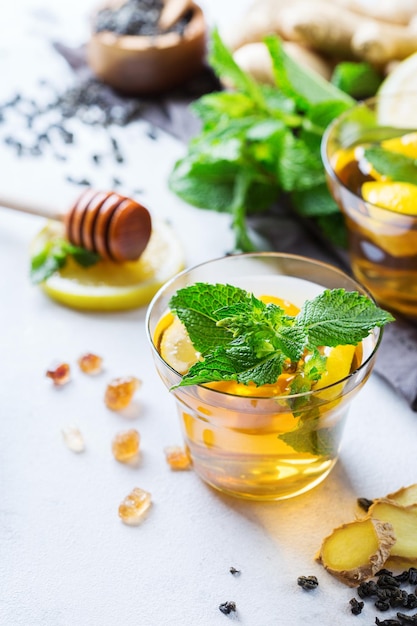 Japanese chinese tea in glass with lemon ginger mint