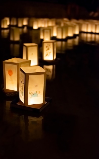 Japanese commemoration of atomic bombs with paper lanterns floating on water