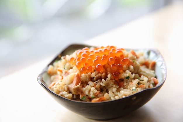 Japanese Cuisine Fried Rice with salmon and caviar on top