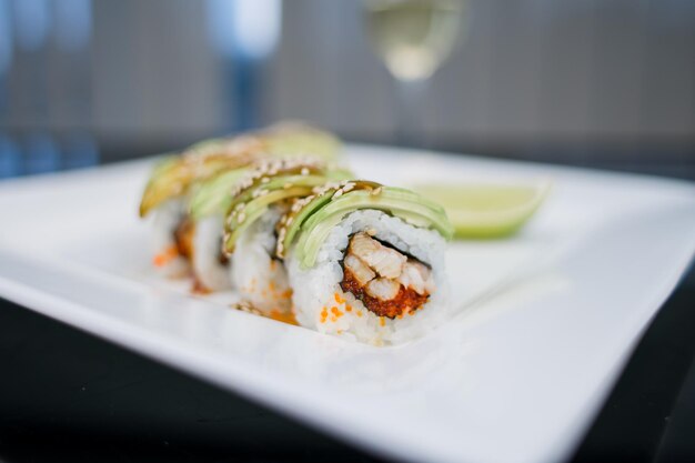 A Japanese cuisine roll with avocado and sesame seeds