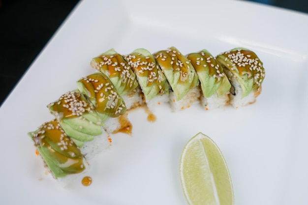 A Japanese cuisine roll with avocado and sesame seeds