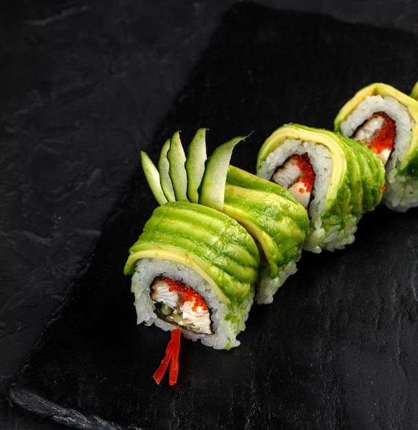 Japanese cuisine Rolls on a dark concrete background