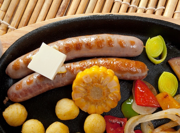 Japanese cuisine .Sausage making roasted with vegetable